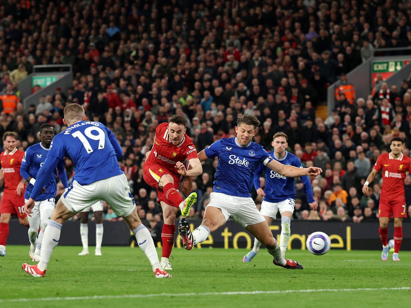 Liverpool beat Everton in feisty derby to keep title charge on track